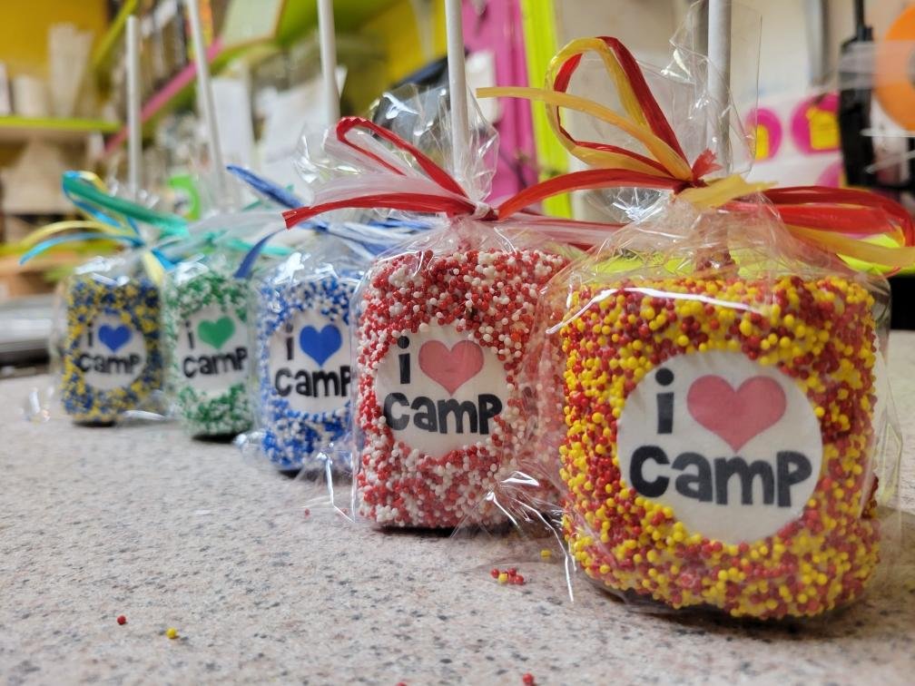 Custom Marshmallow Pops (6x)chocolate covered marshmallowsSavor sweet events with custom made marshmallow pops, decorated with your desired logo and colors! 6 come in an order.