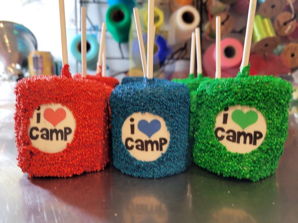 Custom Marshmallow Pops (6x)chocolate covered marshmallowsSavor sweet events with custom made marshmallow pops, decorated with your desired logo and colors! 6 come in an order.