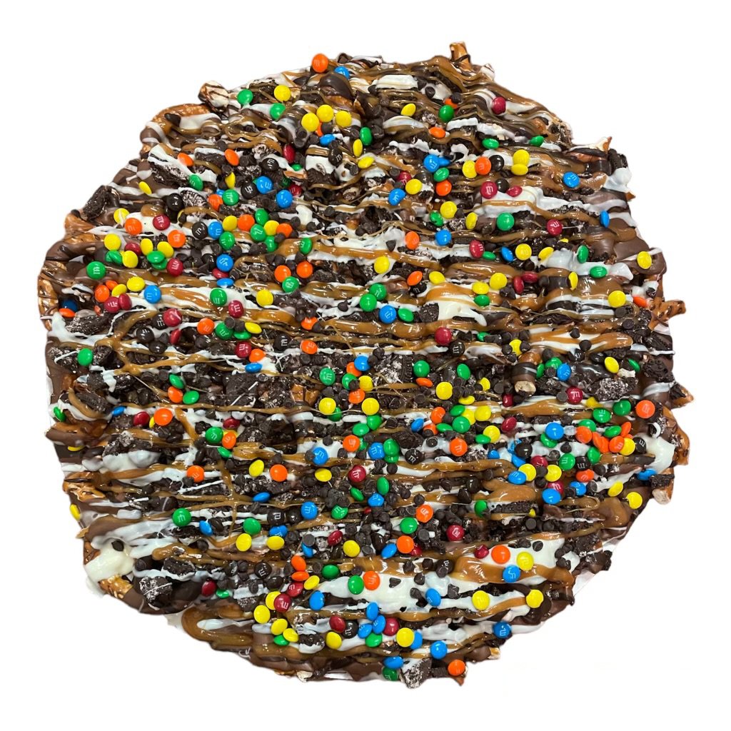 Supreme Chocolate PizzaMilk, Dark &amp; White Chocolate drizzled over pretzels, Oreo pieces, chocolate chips and M&amp;Ms topped with caramel! 14 inch round chocolate pizza!
Same Day Deliv